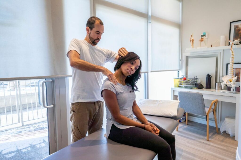 Male Chiropractor adjusting a Female Patient